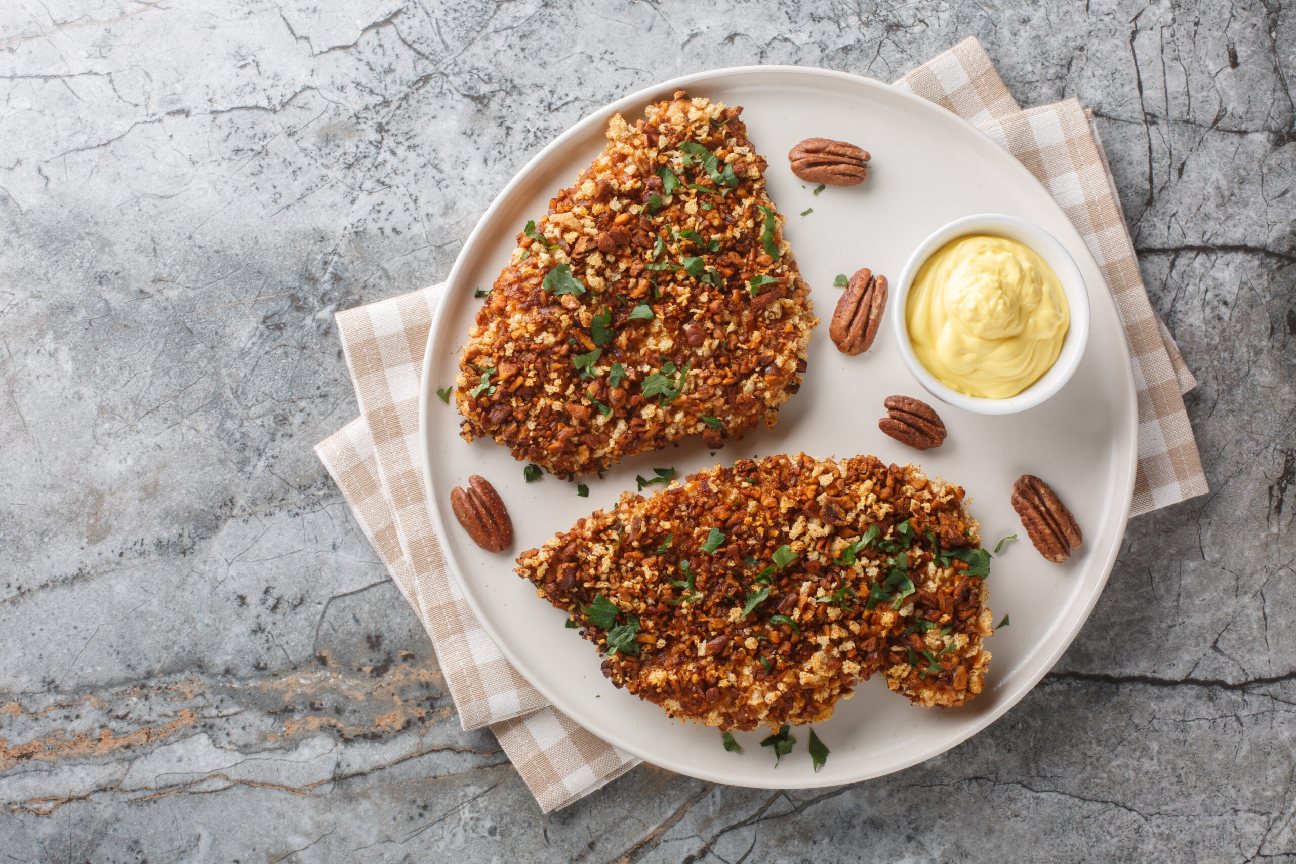 Golden brown breaded pork cutlets served with dipping sauce, made from one of the best pork for cutlets like loin or tenderloin.
