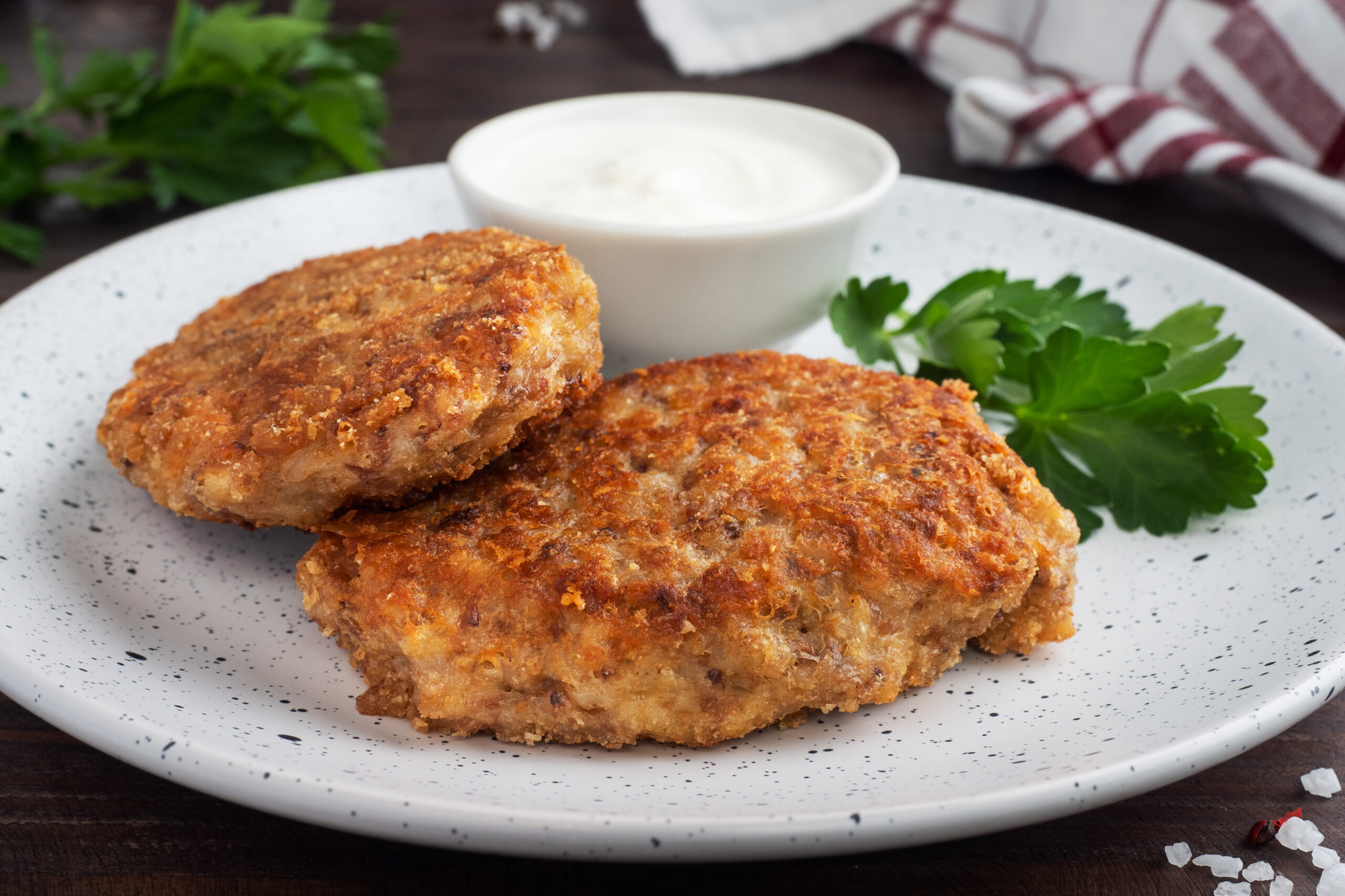Golden brown breaded pork cutlets served with dipping sauce, made from one of the best pork for cutlets like loin or tenderloin.